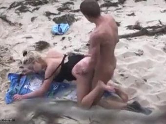 Couple humping at a secluded beach